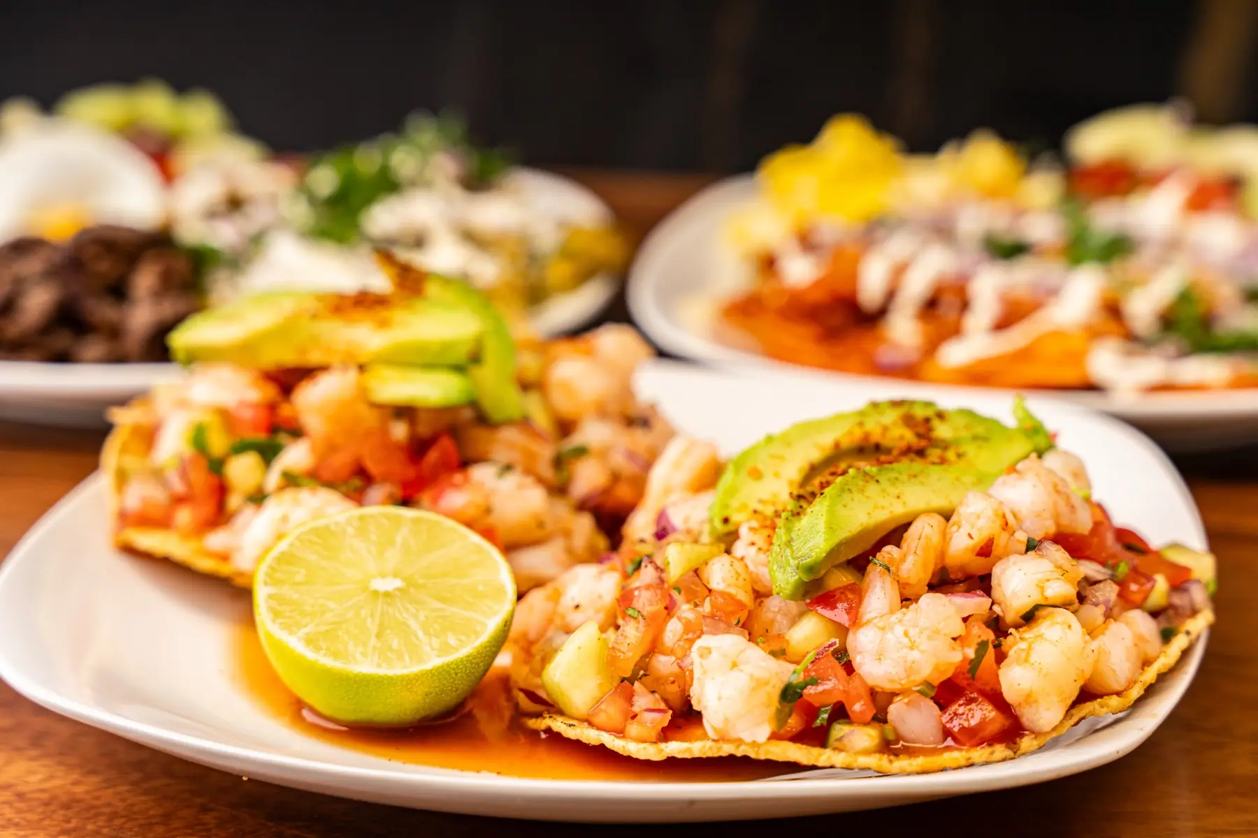Street tacos with onion and cilantro at Monarca Kitchen